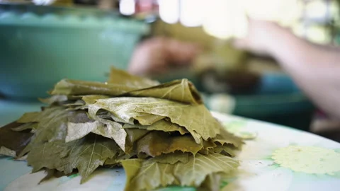 Making Sarmale - Stuffed Vine Leaf Rolls Stock Footage 135684930