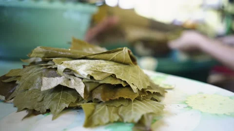Making Sarmale - Stuffed Vine Leaf Rolls Stock Footage 135685075