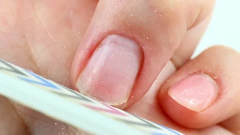 Making self manicure at home with the help of nail file close up Stock Footage 224862966