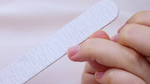 Making self manicure at home with the help of nail file close up Stock Footage 263213860