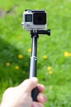 Making a selfie with a camera and stick Stock-Fotos