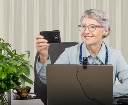 Making selfie in front of computer 库存照片