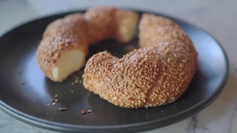 Making sesame bread in a cozy kitchen setting Stock Footage 343479533