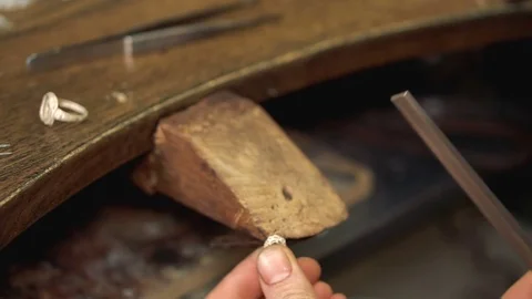 Making the shape of the accessory using sandpaper in the workplace Stock Footage 72966438