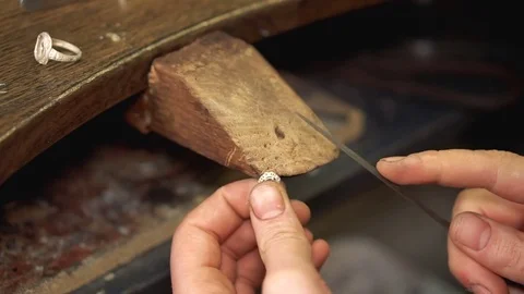 Making the shape of the accessory using sandpaper small size on the wooden Stock Footage 72966498