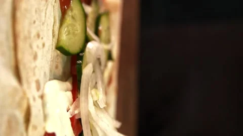 Making Shawarma - Sliced Onions Falling onto Lavash. Vertical Video Stock Footage 247142135