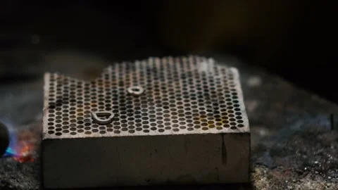 Making a silver heart-shaped pendant. Soldering process Stock Footage 145165688