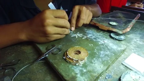 Making silver objects in a factory on Java Indonesia Stock Footage 76683022