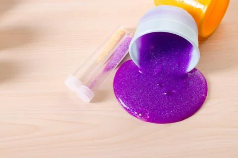 Making slime yourself. Ingredients for making bright glittering slime at home Stock Photos