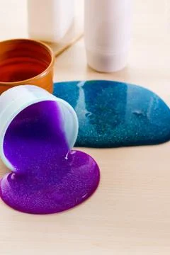 Making slime yourself. Ingredients for making bright glittering slime at home Stock Photos