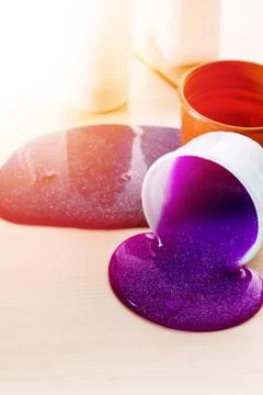 Making slime yourself. Ingredients for making bright glittering slime at home Stock Photos