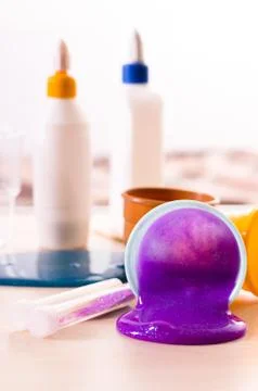 Making slime yourself. Ingredients for making bright glittering slime at home Stock Photos