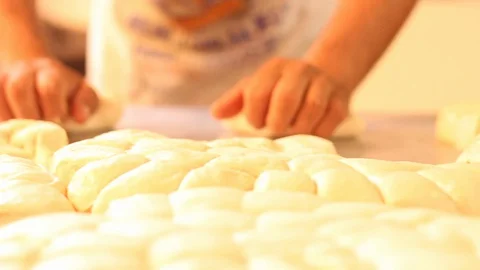 Making small lumps of dough for bread / Mexican sweet bread Stock Footage 130087235