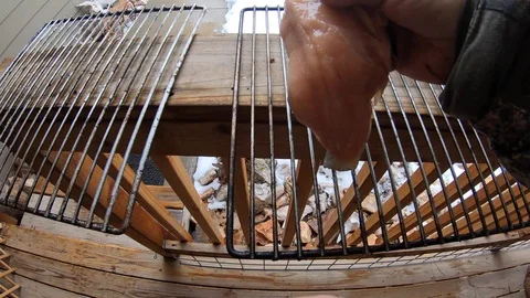 Making Smoked Trout or Salmon - Put Fillets on Wire Rack to Dry Prior to Smoking Stock Footage 127304467