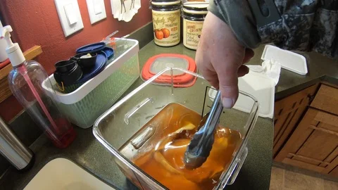 Making Smoked Trout or Salmon - Take Fish Out of Brine and Drain Stock Footage 127304637