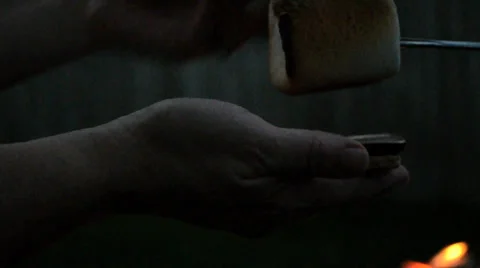 Making a smore at night Stock Footage 31552279