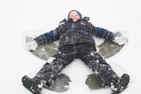 Making snow angels Stock Photos