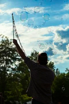 Making soap bubbles at mauerpark Stock Photos