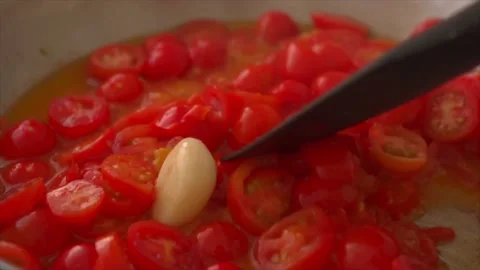 Making spaghetti sauce with fresh tomatoes and garlic Stock Footage 197337304