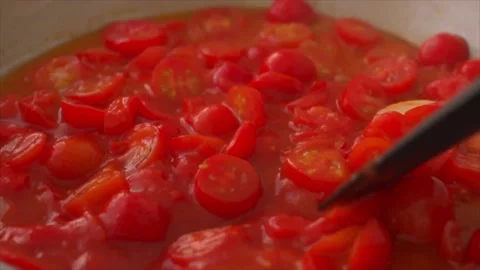 Making spaghetti sauce with fresh tomatoes and garlic Stock-Footage 197337306