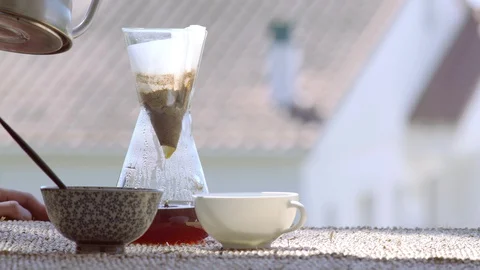 Making speciality coffee at home. Filter coffee on the terrace with a view. Girl Stock Footage 129317543