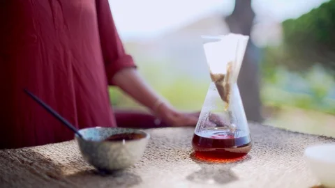 Making speciality coffee at home. Filter coffee on the terrace with a view. Girl Stock Footage 129317573