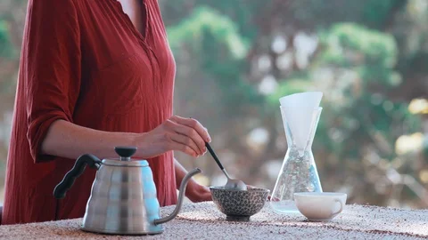 Making speciality coffee at home. Filter coffee on the terrace with a view. Girl Stock Footage 129317633