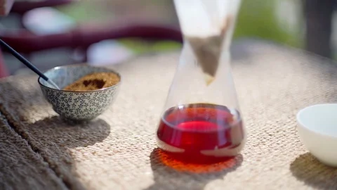 Making speciality coffee at home. Filter coffee on the terrace with a view. Girl Stock Footage 129317758