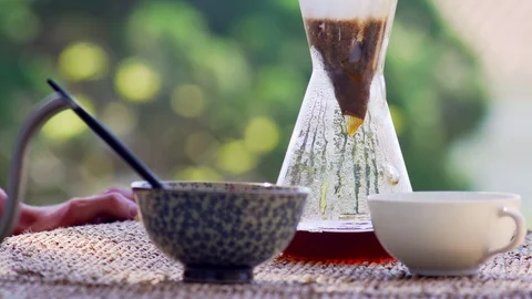 Making speciality coffee at home. Filter coffee on the terrace with a view. Girl Stock Footage 129317910