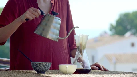 Making speciality coffee at home. Filter coffee on the terrace with a view. Girl Stock Footage 129317958