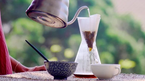 Making speciality coffee at home. Filter coffee on the terrace with a view. Girl Stock Footage 129318015