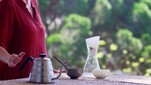 Making speciality coffee at home. Filter coffee on the terrace with a view. Girl Stock Footage 129318160