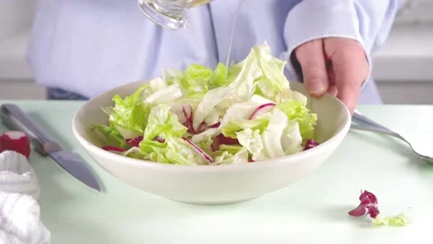 Making spring vegetable salad Stock Footage 169587373