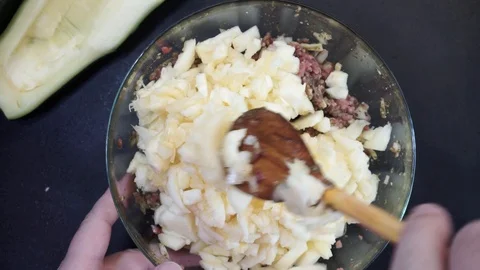 Making squash and meat stuffing overhead Stock Footage 119781111