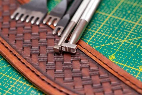 Making stamping on leather with handtools Stock Photos