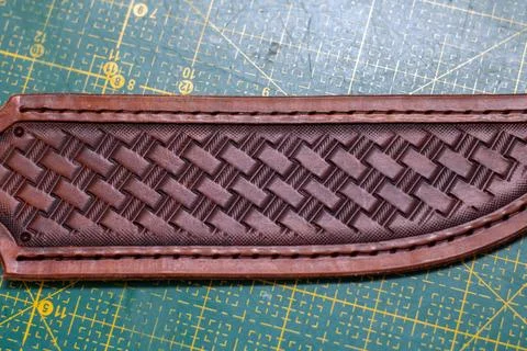 Making stamping on leather with handtools Stock Photos