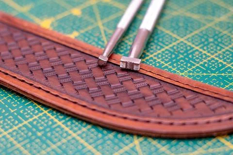 Making stamping on leather with handtools 스톡 사진