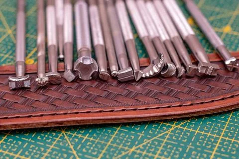 Making stamping on leather with handtools Stock Photos