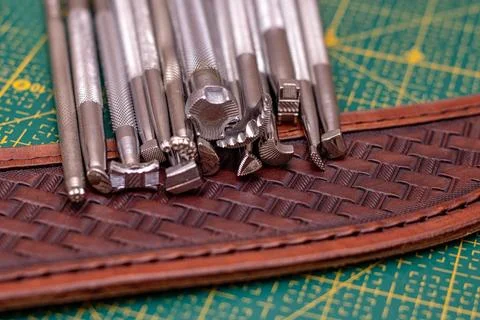 Making stamping on leather with handtools Stock Photos