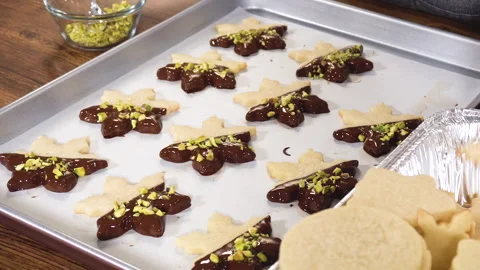 Making Star-Shaped Cookies with Chocolate and Peppermint Chips Stock Footage 317823286