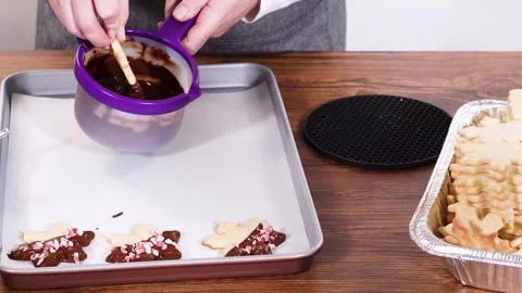 Making Star-Shaped Cookies with Chocolate and Peppermint Chips Stock Footage 317837047