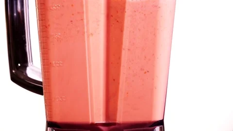 Making strawberry fruit shake in blender on white 4K Stock Footage 76257254