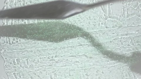Making strokes on transparent gel smear with metal spatula Stock Footage 170358279