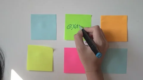 Making study plans for exams using sticky notes and markers Stock Footage 340462607