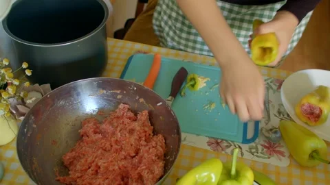 Making Stuffed Peppers with Ground Meat and various Vegetables Stock Footage 318922420