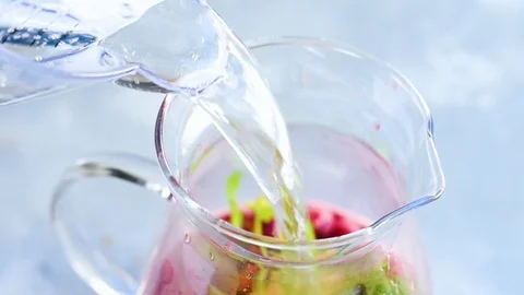 Making summer raspberry lemonade at home Stock Footage 92262409