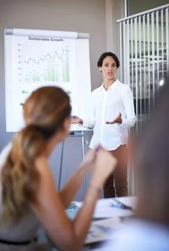 Making sure everyones on the same page. a businesswoman giving a presentation to Foto stock