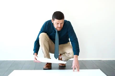 Making sure his plans are up to code. Full length shot of a handsome mature male Stock Photos