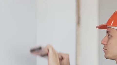 Making sure wall is straight Stock Footage 73442114