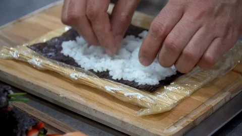 Making sushi by a chef Stock Footage 106628440